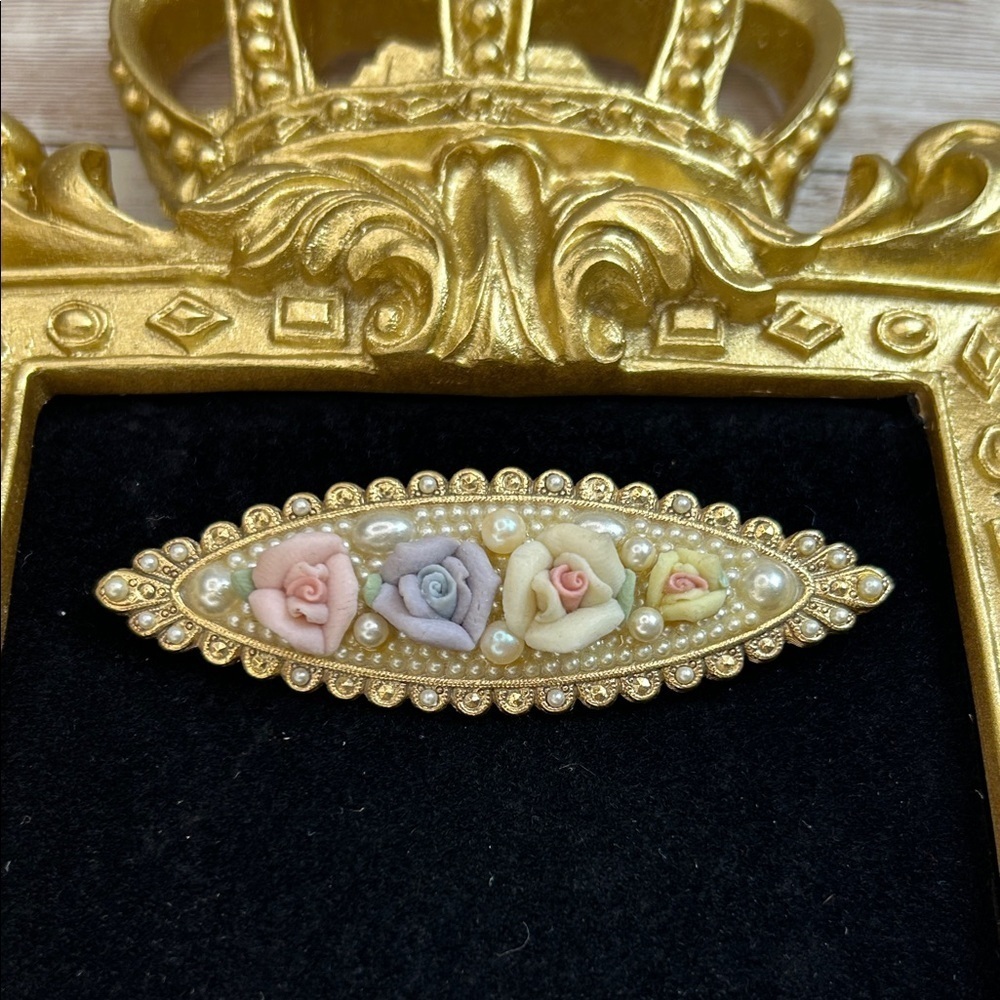 vintage goldtone elongated brooch pin with pastel pink, yellow, and purple roses